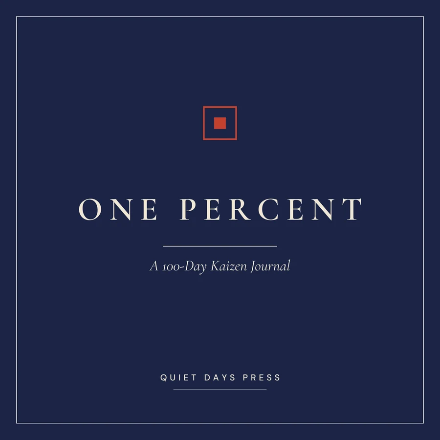 One Percent paperback cover: the words ONE PERCENT set in cream letterspaced serif capitals on a deep indigo field, with a small red square-in-square seal above and the italic subtitle 'A 100-Day Kaizen Journal' below, over the Quiet Days Press imprint line.